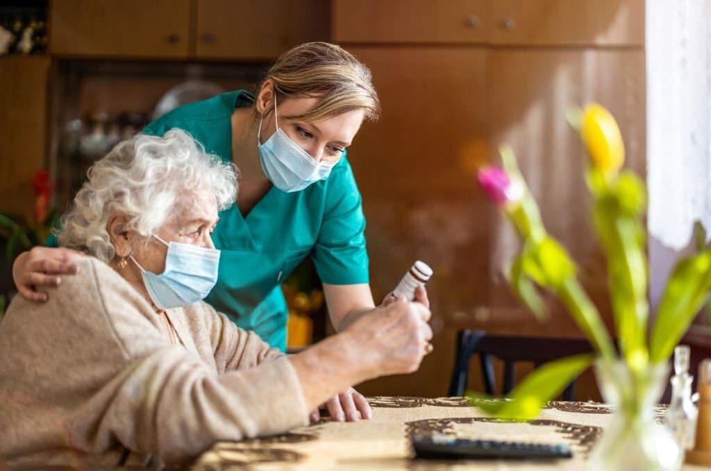 A Nurse proving In-home care to a aging